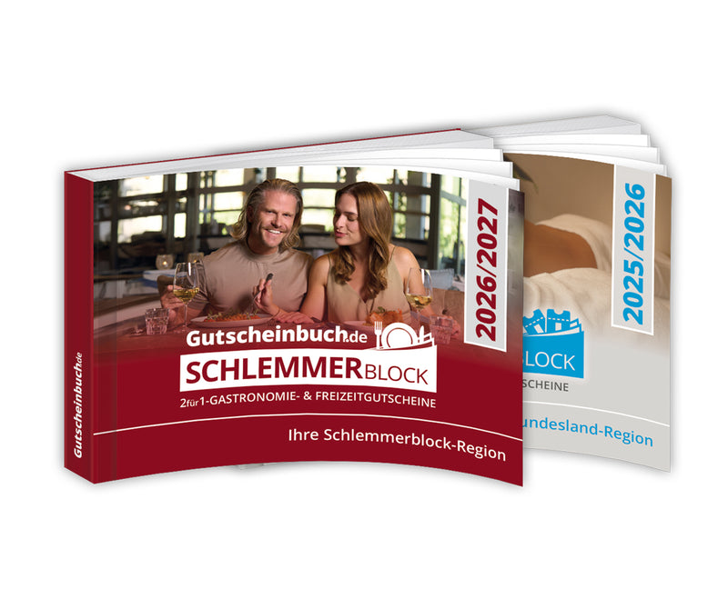 Zwei Gutscheinbücher von Gutscheinbuch.de, darunter der rote ‚Schlemmerblock 2026/2027‘ mit einem Paar beim Essen auf dem Cover sowie weitere Ausgaben im Hintergrund